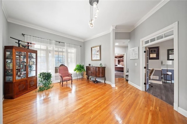 19 Spring Lake Trl NE, White, GA 30184 - living area featuring light wood finished floors, ornamental molding, and baseboards