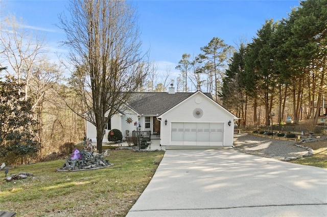 ranch-style house featuring a garage, a front yard, driveway, and a chimney