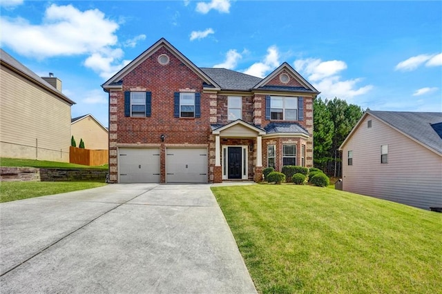 view of front of house with a garage, brick siding, fence, and a front lawn