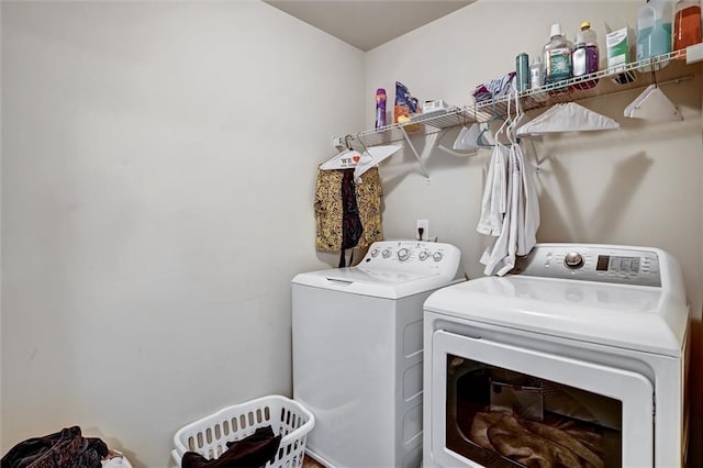 laundry area featuring laundry area and separate washer and dryer