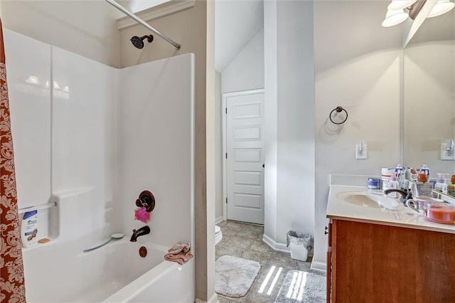 bathroom with toilet, baseboards, shower / washtub combination, and vanity