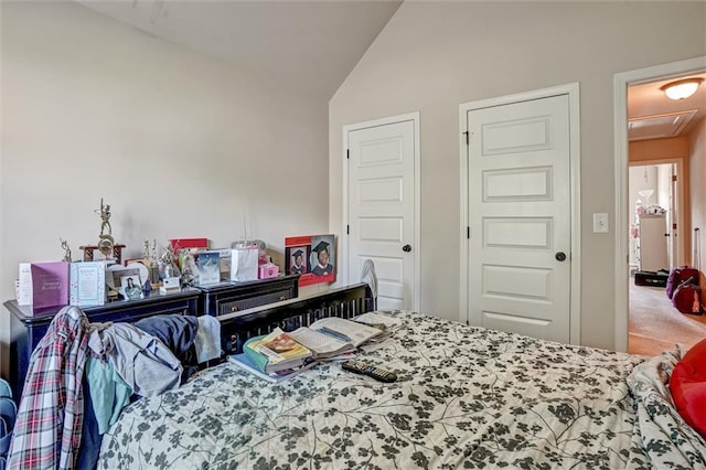 carpeted bedroom with vaulted ceiling