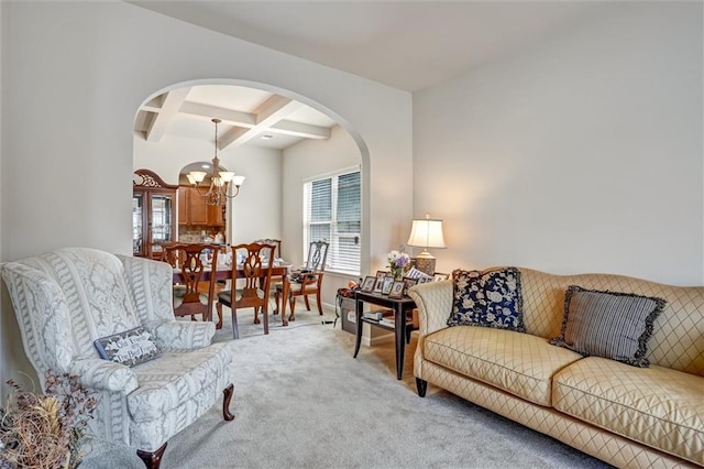 living area with plenty of natural light, carpet, coffered ceiling, and beamed ceiling