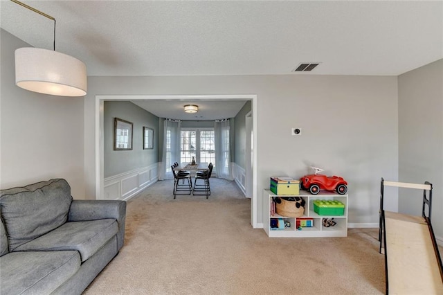 game room with carpet flooring and visible vents