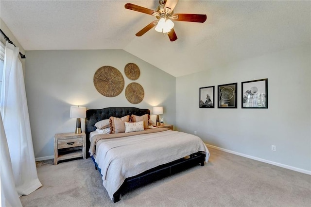 carpeted bedroom with a ceiling fan, lofted ceiling, and baseboards