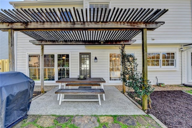 view of patio / terrace featuring a grill and a pergola