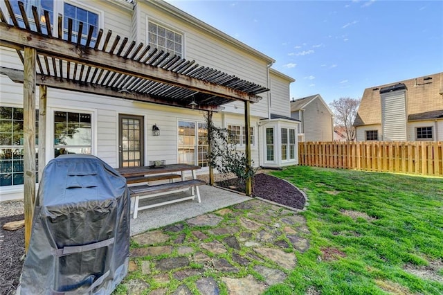 rear view of house with a patio area, fence, a pergola, and a yard