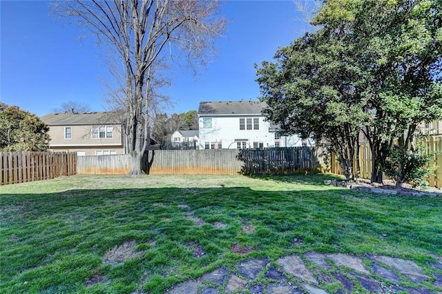 view of yard with a fenced backyard