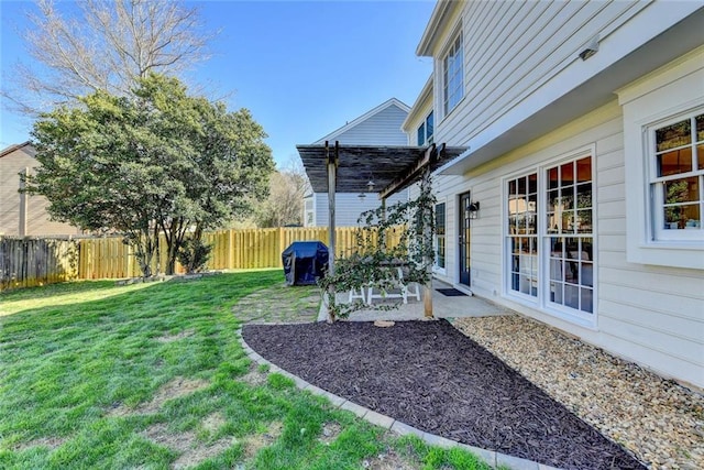 view of yard featuring a patio and a fenced backyard