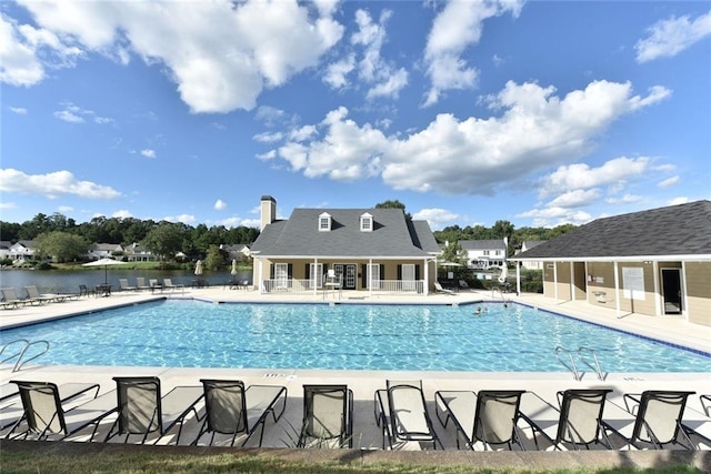 community pool featuring a patio area and fence