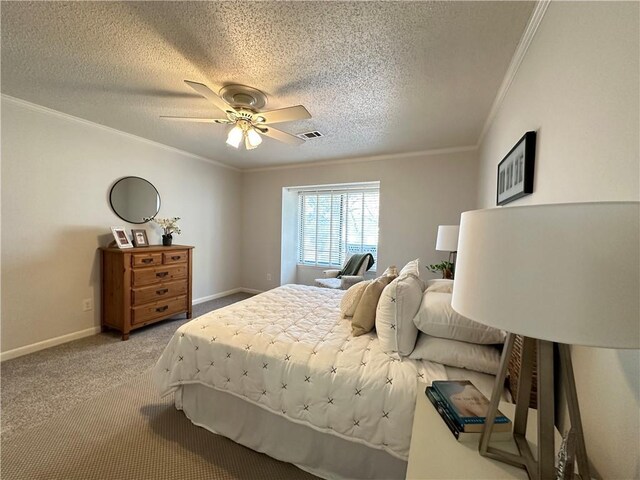 carpeted bedroom featuring ceiling fan, ornamental molding, and a textured ceiling