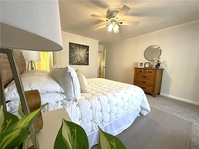 bedroom featuring ornamental molding, carpet, a textured ceiling, and a ceiling fan