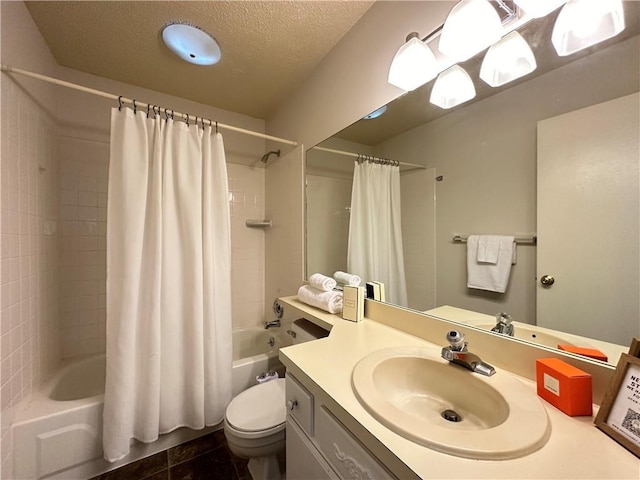 bathroom featuring a textured ceiling, shower / bath combo, vanity, and toilet