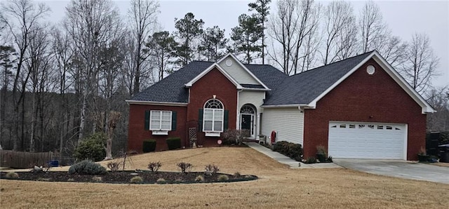 view of front of house featuring brick siding, driveway, an attached garage, and a front yard