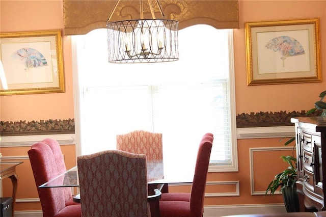 dining space featuring a chandelier