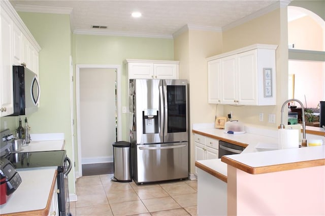 kitchen with visible vents, white cabinets, appliances with stainless steel finishes, and a sink