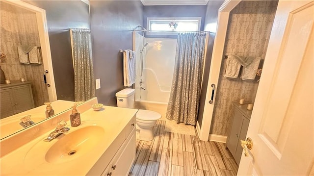 full bathroom featuring shower / tub combo with curtain, toilet, ornamental molding, wood finished floors, and vanity