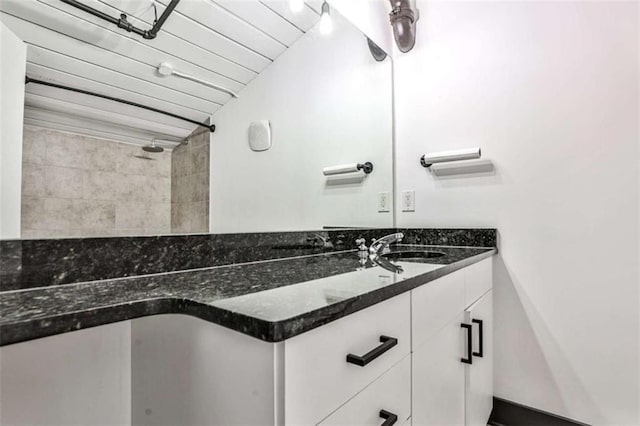 bathroom with wood ceiling and vanity