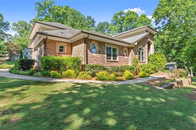 5816 Chamblee Dunwoody Rd, Atlanta, GA 30338 - view of side of property featuring a yard and brick siding