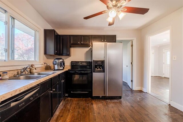 kitchen with ceiling fan, sink, black appliances, and dark hardwood / wood-style floors