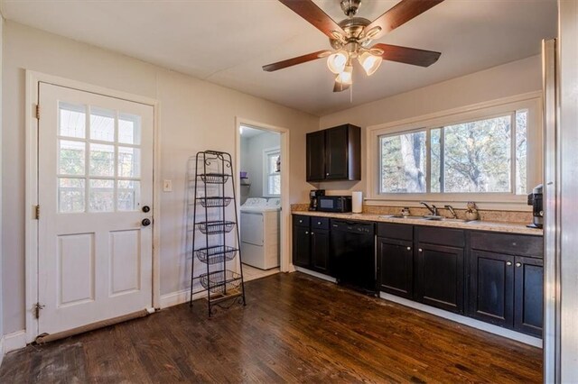 kitchen with black appliances, plenty of natural light, dark hardwood / wood-style flooring, and washer / clothes dryer