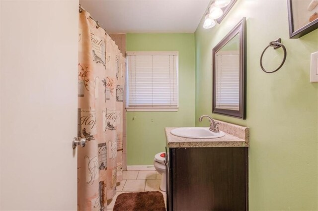 bathroom featuring tile patterned floors, vanity, toilet, and a shower with curtain