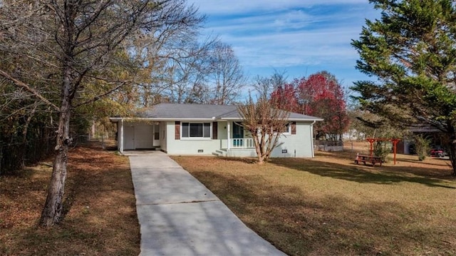 ranch-style home featuring a carport, a porch, and a front lawn