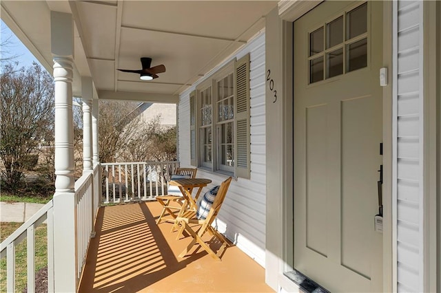 balcony with ceiling fan and a porch