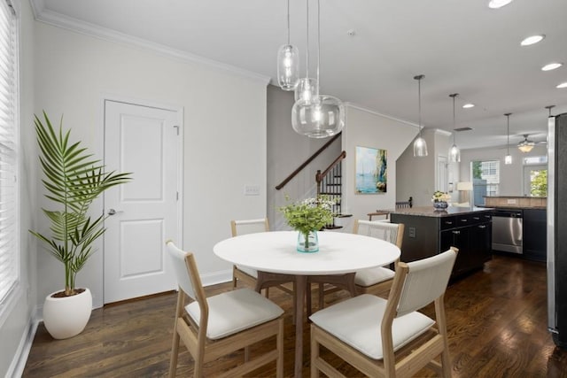 dining room featuring crown molding and dark hardwood / wood-style flooring