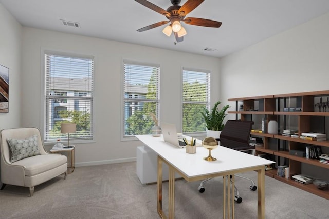 office area with ceiling fan and light colored carpet