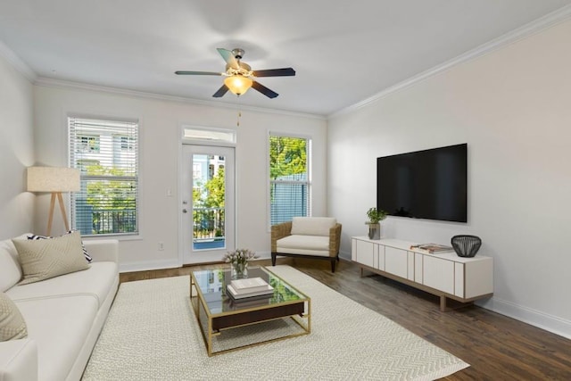 living room featuring ornamental molding, dark hardwood / wood-style floors, and ceiling fan