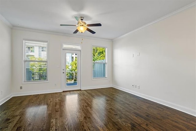 interior space with ornamental molding, ceiling fan, and dark hardwood / wood-style flooring