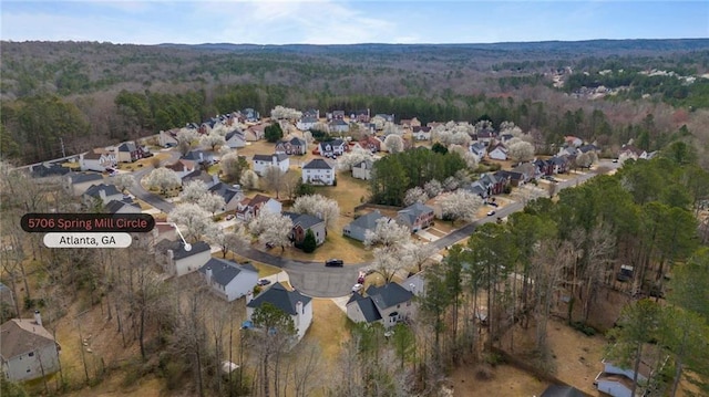 bird's eye view featuring a residential view and a view of trees