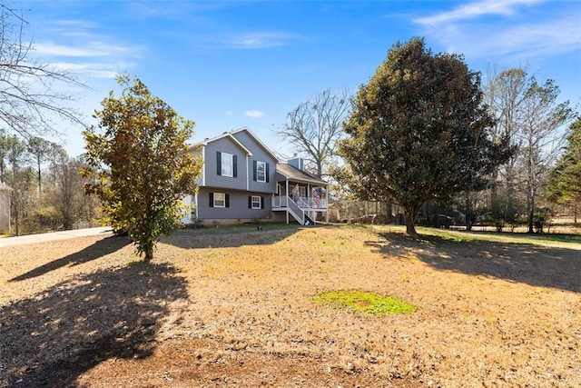 exterior space featuring a porch, a chimney, and fence