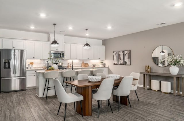 947 Edwin Ln, Sugar Hill, GA 30518 - dining space with wood finished floors and recessed lighting