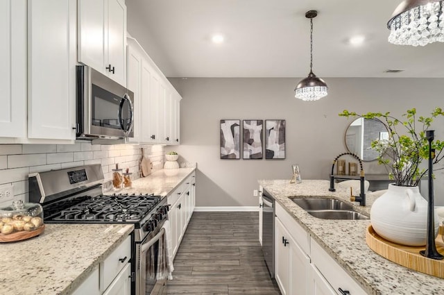 947 Edwin Ln, Sugar Hill, GA 30518 - kitchen with stainless steel appliances, white cabinets, dark wood-style floors, decorative backsplash, and recessed lighting