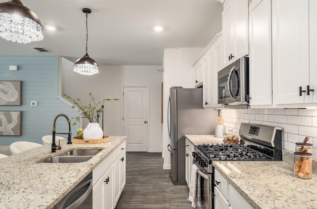 947 Edwin Ln, Sugar Hill, GA 30518 - kitchen featuring appliances with stainless steel finishes, dark wood finished floors, white cabinetry, backsplash, and recessed lighting