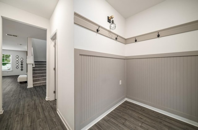 947 Edwin Ln, Sugar Hill, GA 30518 - hall with dark wood finished floors, wainscoting, and stairs