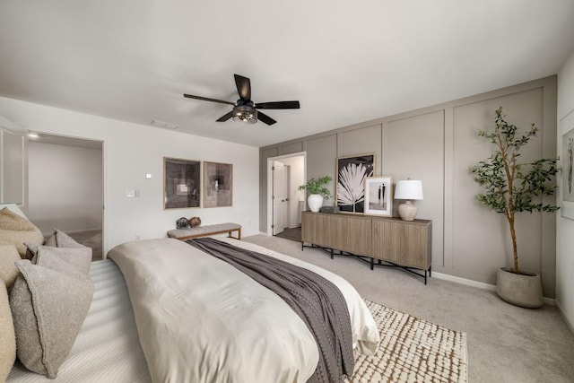947 Edwin Ln, Sugar Hill, GA 30518 - bedroom with a decorative wall, light carpet, a ceiling fan, and ensuite bathroom