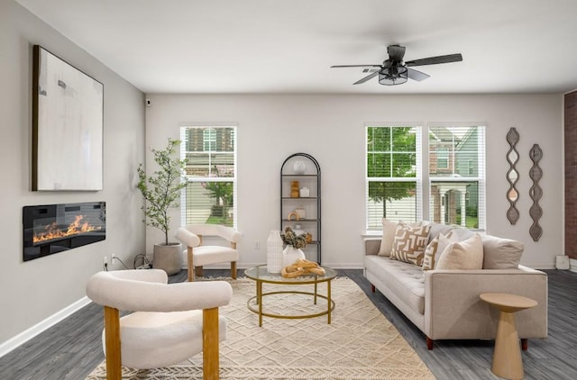 947 Edwin Ln, Sugar Hill, GA 30518 - living area with wood finished floors, ceiling fan, and a glass covered fireplace