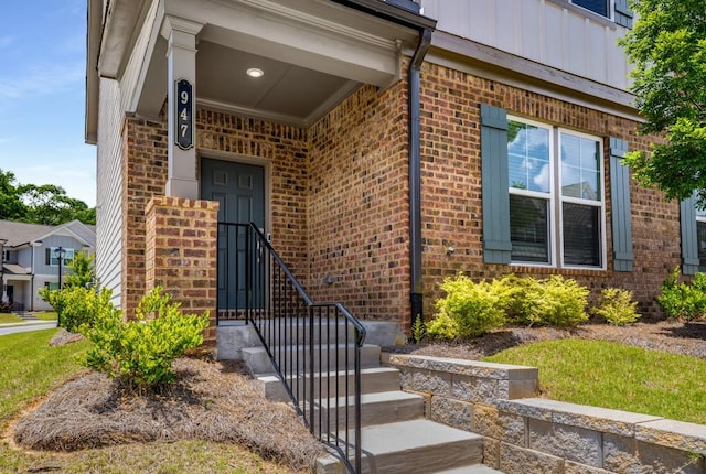 947 Edwin Ln, Sugar Hill, GA 30518 - doorway to property with board and batten siding and brick siding