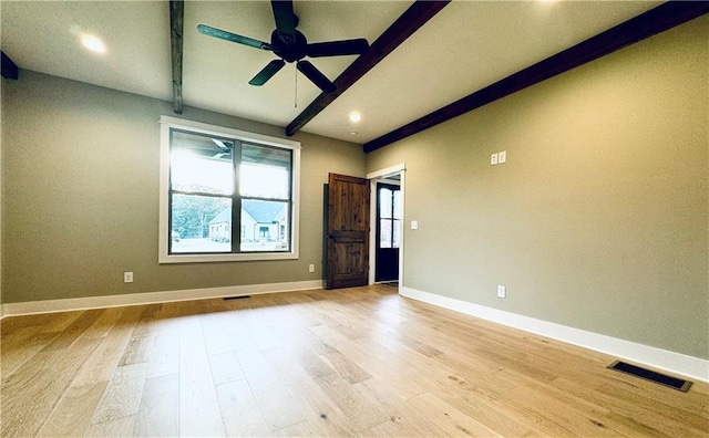 spare room featuring beamed ceiling, ceiling fan, and light hardwood / wood-style floors