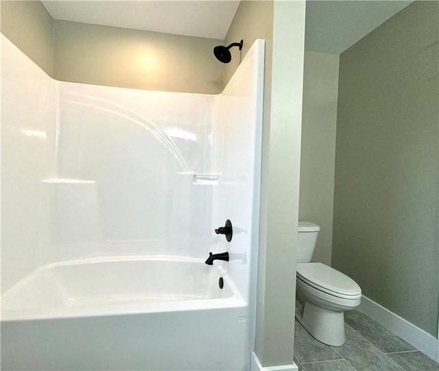 bathroom featuring shower / tub combination, tile patterned floors, and toilet