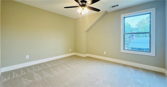 bonus room featuring light carpet and ceiling fan