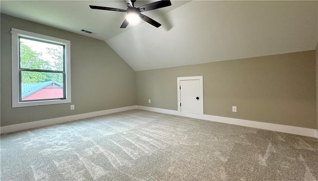 additional living space with lofted ceiling, carpet, and ceiling fan