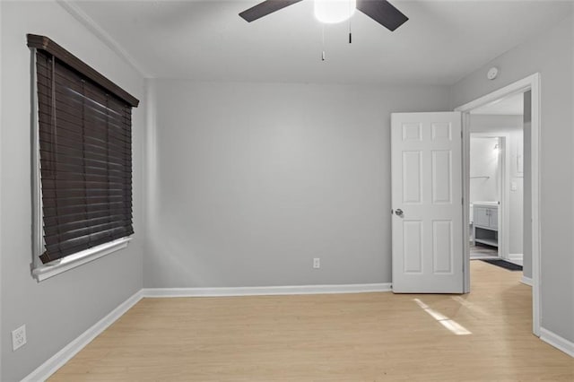 spare room featuring ceiling fan and light wood-type flooring