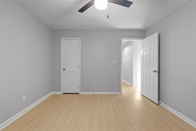 unfurnished bedroom featuring light hardwood / wood-style floors and ceiling fan