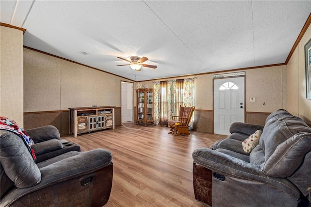 2860 Jack Bryant Cir, Gainesville, GA 30507 - living room featuring crown molding, wood finished floors, a textured ceiling, ceiling fan, and a wainscoted wall