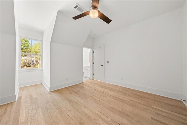 empty room with light hardwood / wood-style flooring and ceiling fan