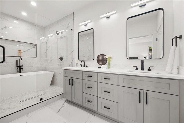 bathroom featuring vanity and plus walk in shower